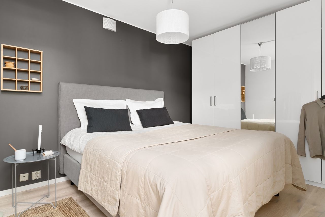 Bed A stylish and modern bedroom interior with luxury bedding and chic furniture setup.