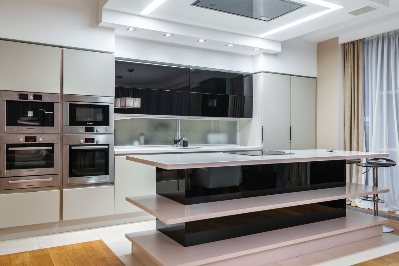 High-end contemporary kitchen featuring sleek design and modern appliances for elegant living.