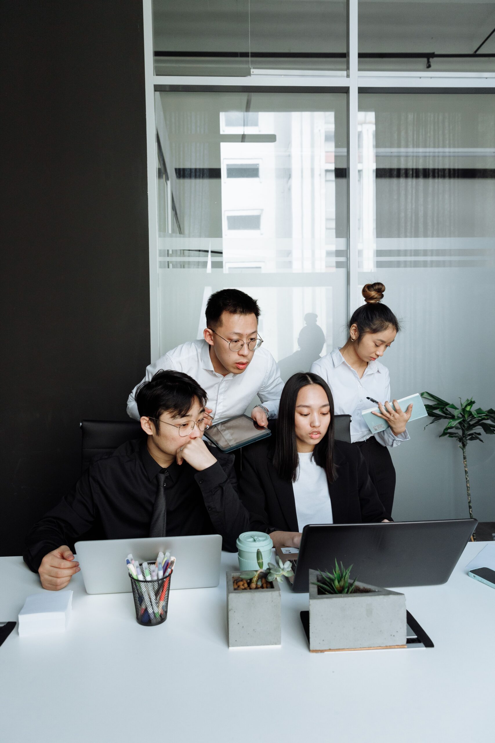 A diverse group of professionals working together in a contemporary office setting.