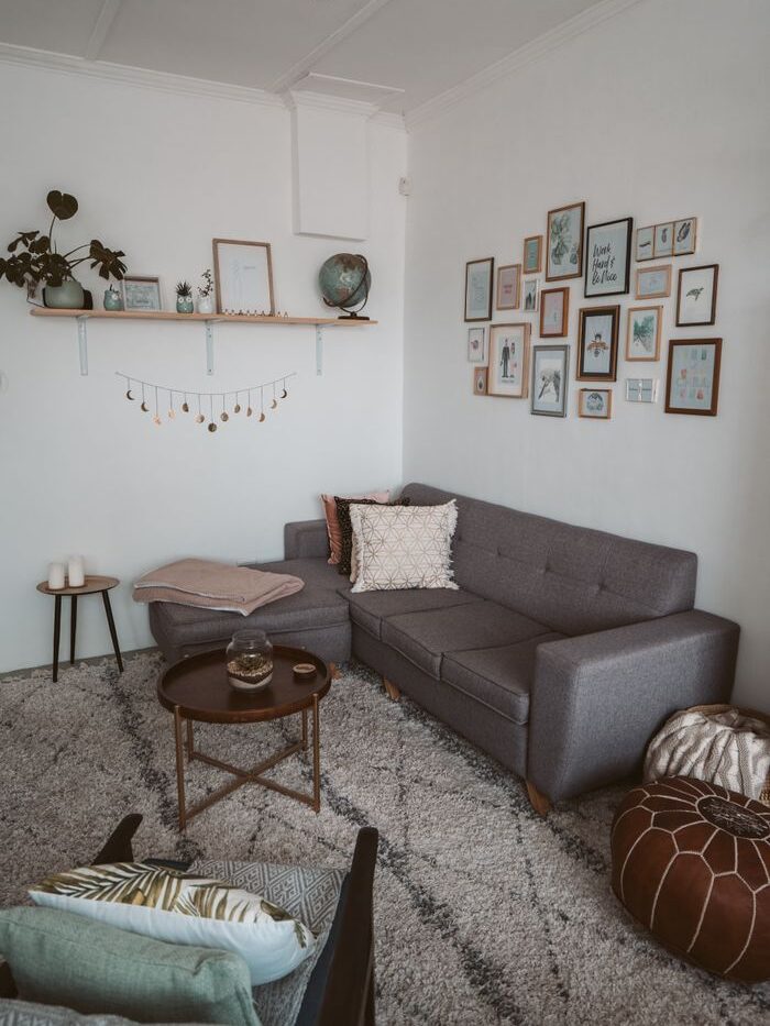 A modern living room with a sectional sofa and wall art for a warm, cozy ambiance.